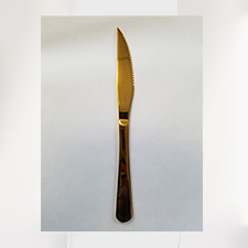 Gold steak knife